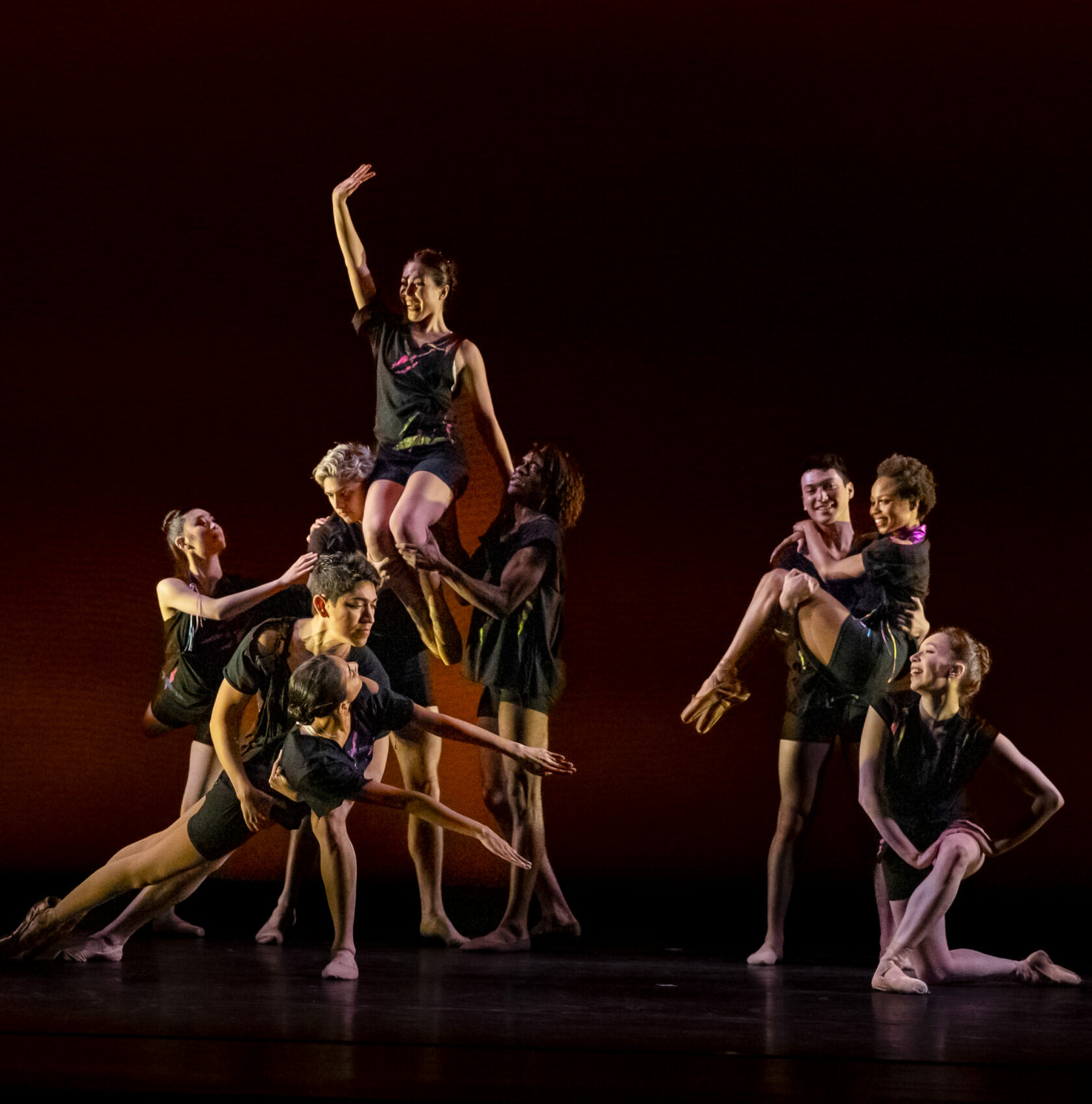 Dancers holding a pose in all different levels.
